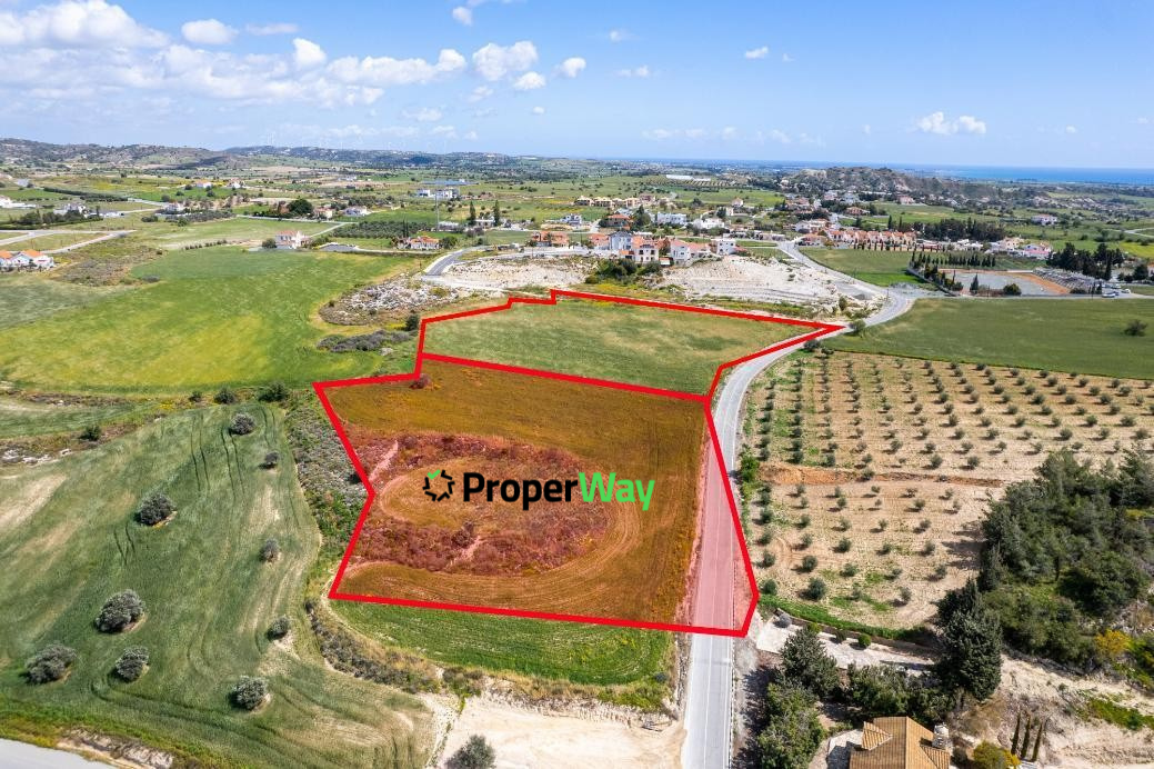8,195sqm residential share in Anafotida, clearly outlined in green to show the property boundaries and surrounding agricultural land